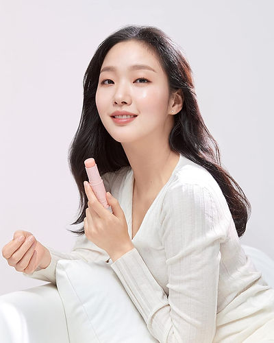 The iconic pink KAHI Wrinkle Bounce Balm, a portable, on-the-go skincare stick for touch-ups and instant glow.